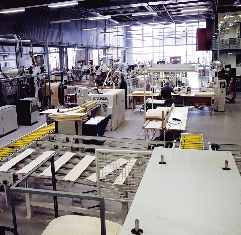 FCA Vassinger¯d Fritz Hansen factory - stackable chairs sticks  of veneer ready for edge-glueing